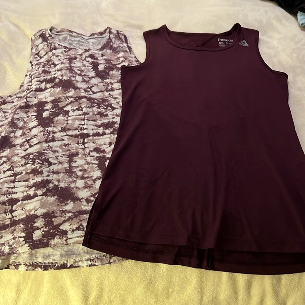 Size xs Reebok tank tops, burgundy and burgundy tie dye.